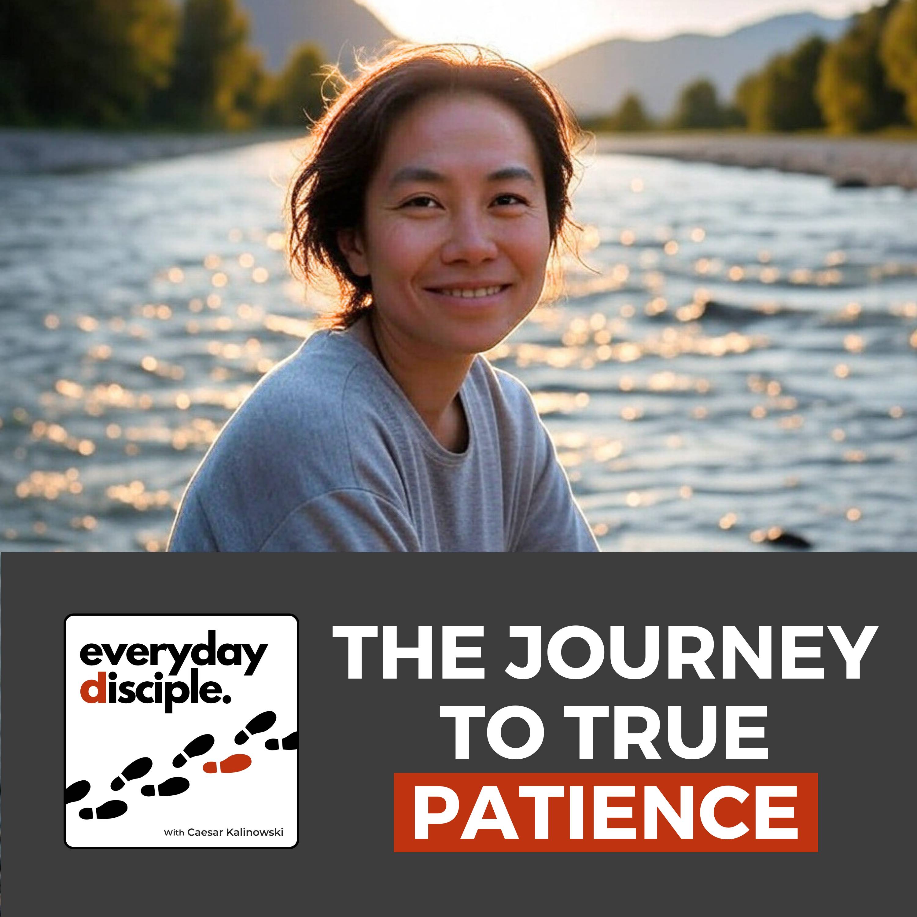 A woman with short hair wearing a gray sweatshirt smiles gently while sitting by a river during golden hour, with sunlight sparkling on the water and mountains in the background.