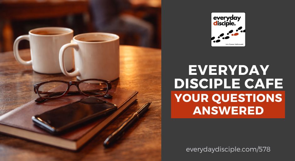 Coffee mugs and personal items rest on a wooden café table, creating a relaxed conversation setting.