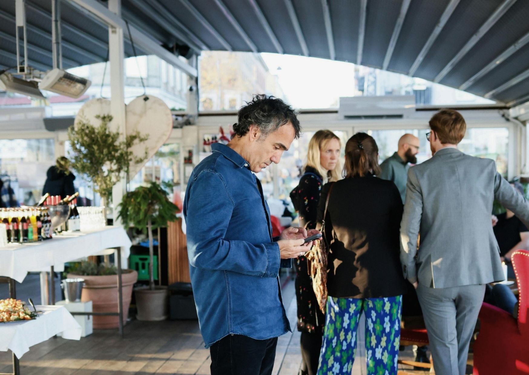 Two people walking together on a neighborhood street, mid-conversation — life-on-life discipleship in everyday rhythms